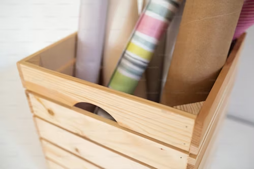 Rolled wallpaper in a wooden box